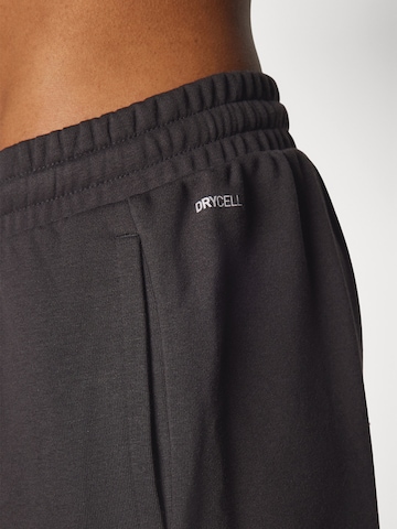 PUMA Tapered Sportbroek 'TAD Essential' in Zwart