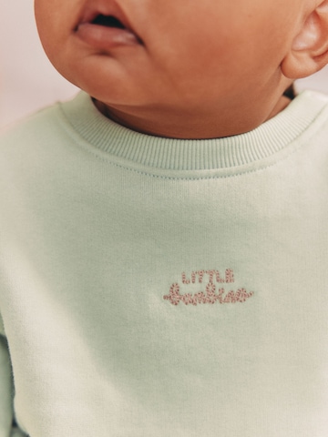 Next Juoksupuku värissä vihreä