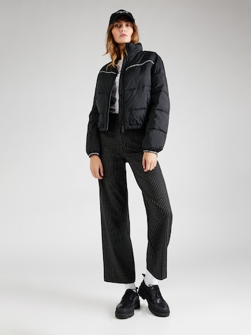 Tommy Jeans Φθινοπωρινό και ανοιξιάτικο μπουφάν σε μαύρο