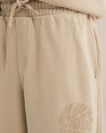 Tapered Pantaloni di WE Fashion in beige