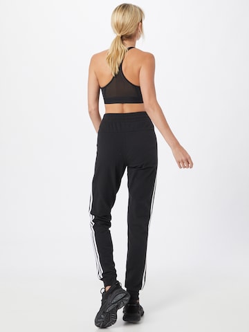 ADIDAS SPORTSWEAR Дънки Tapered Leg Спортен панталон 'Essentials' в черно