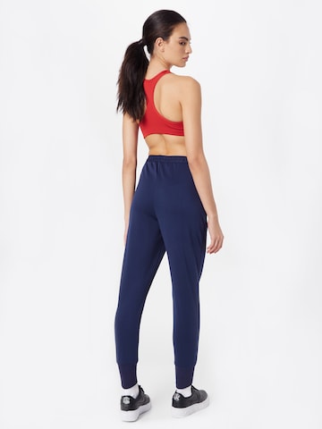 Effilé Pantalon de sport NIKE en bleu