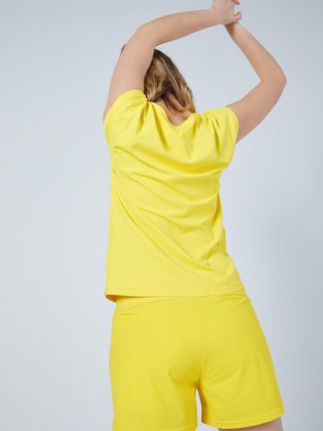 SPORTKIND - Camiseta funcional 'Loose Fit' en amarillo