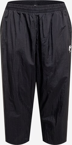 Loosefit Pantaloni sport de la Nike Sportswear pe negru: față