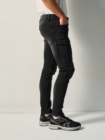 KOROSHI - Skinny Pantalón vaquero cargo en negro