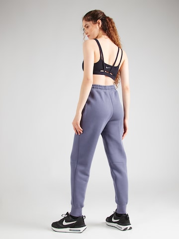 Effilé Pantalon 'TCH FLC' Nike Sportswear en violet