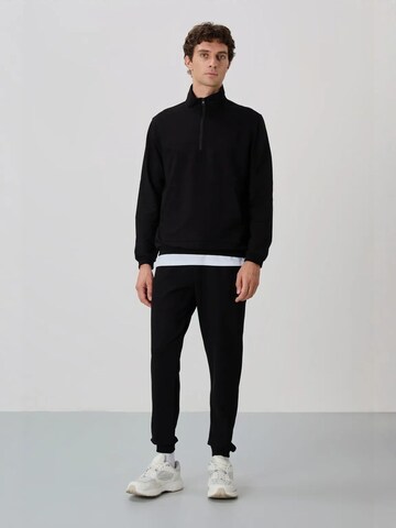 Tommy Life Tracksuit in Black: front