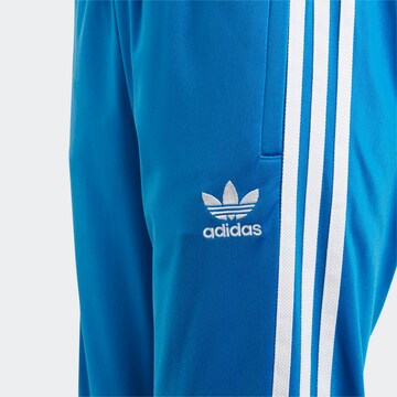 ADIDAS ORIGINALS Tapered Broek 'Adicolor' in Blauw