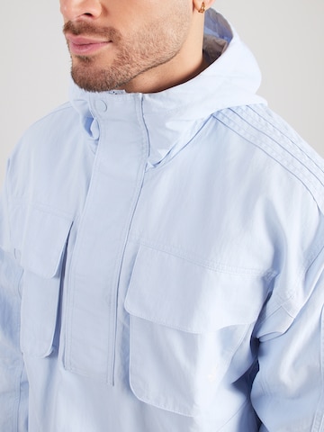 ADIDAS ORIGINALS Přechodná bunda 'BRITCORE' – modrá