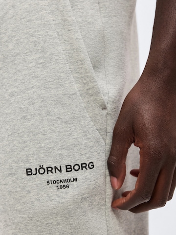 BJÖRN BORG - Tapered Calças de desporto 'ESSENTIAL 1' em cinzento