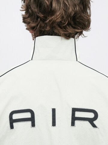 Nike Sportswear Prehodna jakna 'AIR' | bež barva