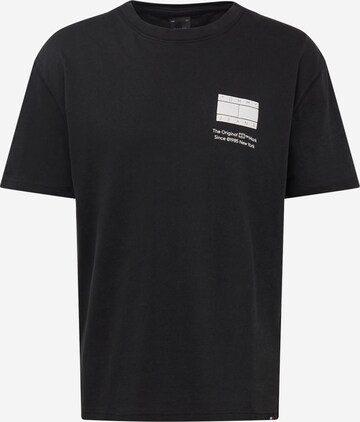 T-Shirt 'Essential' Tommy Jeans en noir : devant