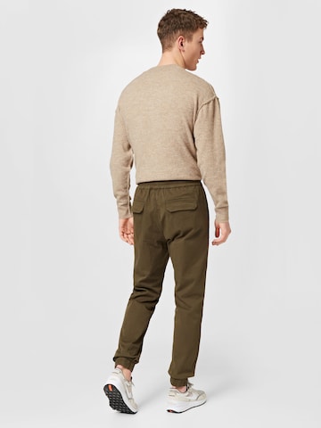 ABOUT YOU Tapered Broek 'Alen' in Groen