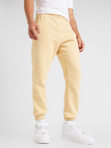 Nike Sportswear - Tapered Pantalón 'CLUB FLEECE' en beige: frente