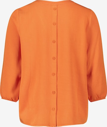 Cartoon - Blusa em laranja