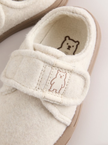 Neonato di Next in beige