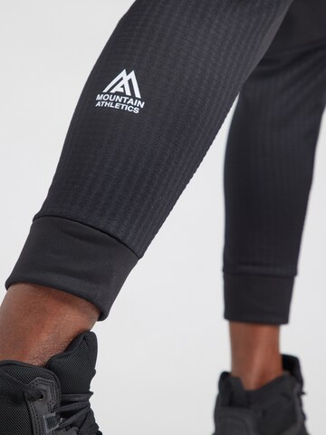 THE NORTH FACE - Tapered Pantalón deportivo 'Mountain Athletics' en negro