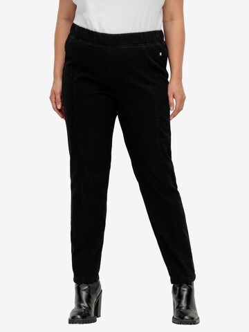 SHEEGO Slim fit Trousers in Black: front