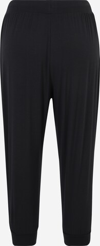 Tapered Pantaloni sportivi di CURARE Yogawear in nero