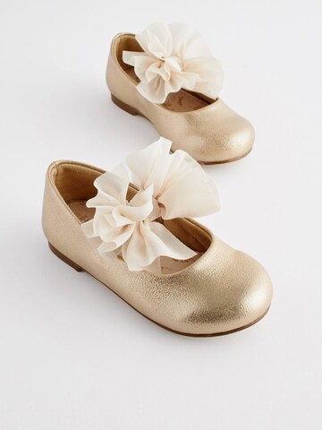 Next - Bailarina en oro