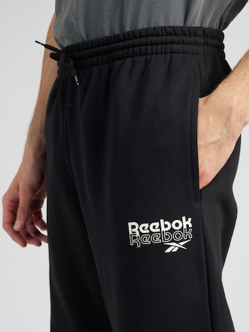 Reebok Конический (Tapered) Спортивные штаны 'IDENTITY BRAND PROUD' в Черный