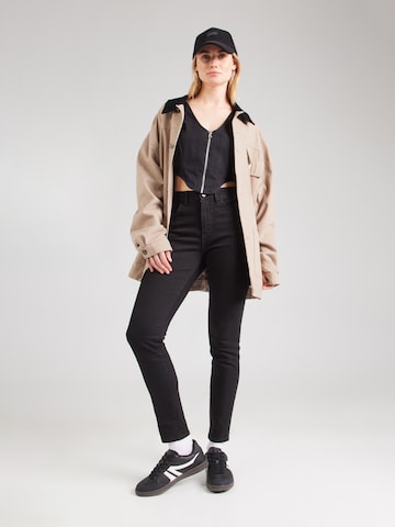 WRANGLER Skinny Džíny – černá