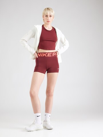 NIKE Skinny Spodnie sportowe w kolorze czerwony