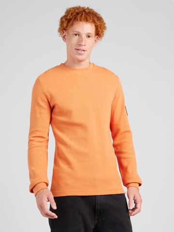 T-Shirt Calvin Klein Jeans en orange : devant