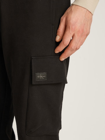 juoda Calvin Klein Jeans Siaurėjantis Kelnės