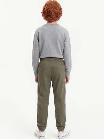Calvin Klein Jeans Tapered Housut 'ESSENTIAL' värissä vihreä