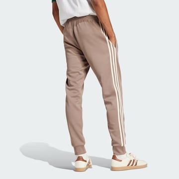 ADIDAS ORIGINALS Tapered Broek in Bruin