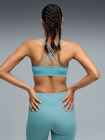 Top sportivo 'Puma Move Strappy Bra' di PUMA in blu