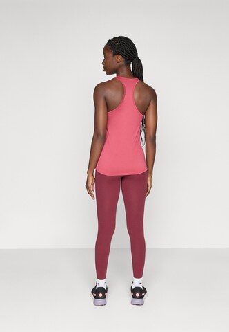 PUMA Skinny Sports trousers in Red