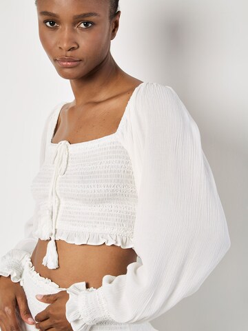 Haut Apricot en blanc