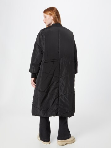 Manteau mi-saison 'Carolina' co'couture en noir