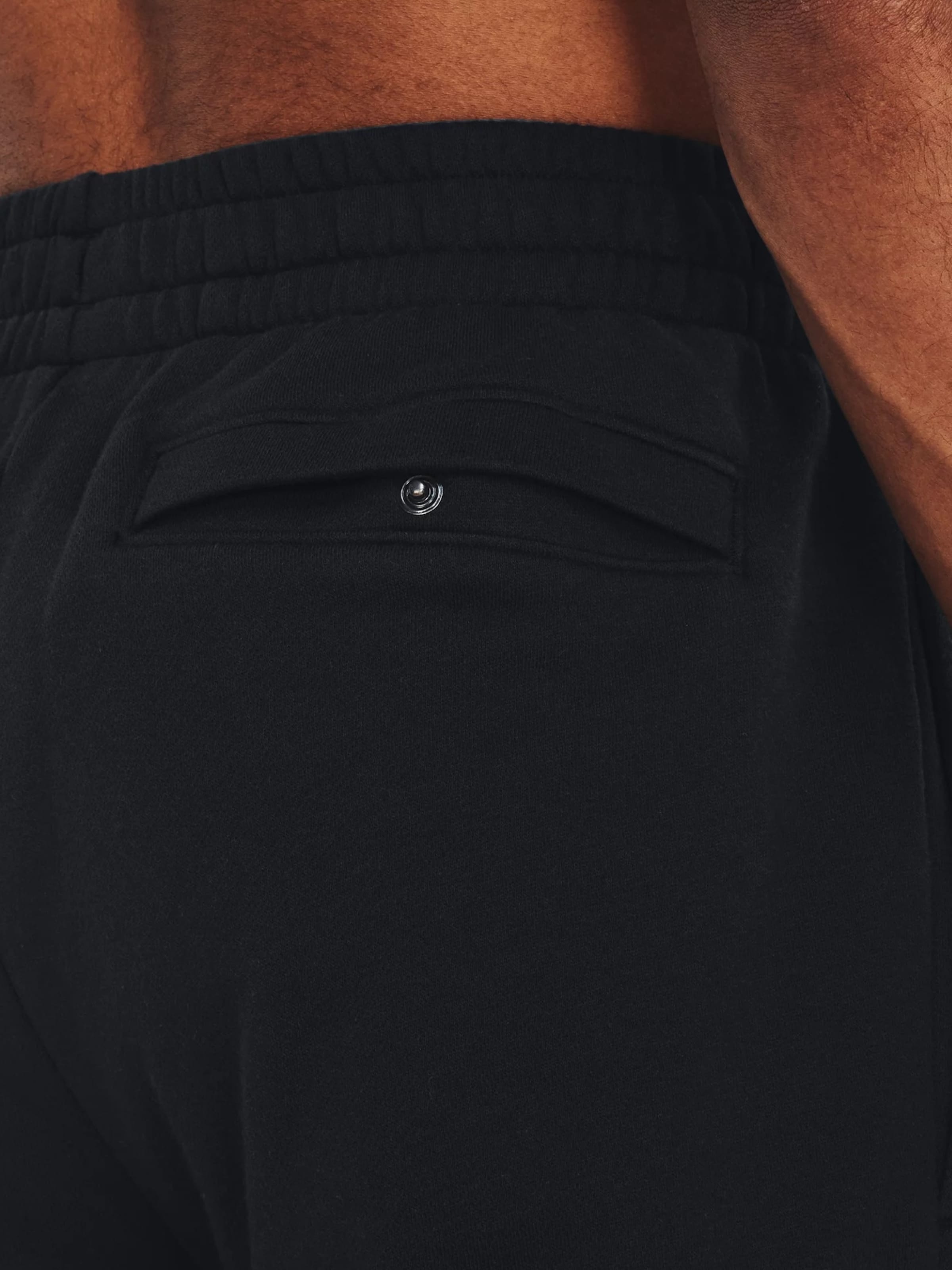 Loosefit Pantalon de sport 'Rival' UNDER ARMOUR en noir