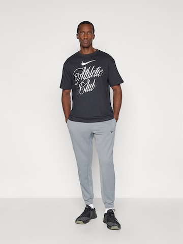 NIKE Tapered Sportnadrágok 'FLEX' - szürke