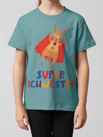 watabout.kids T-Shirt 'Känguru Superschwester' in Grün