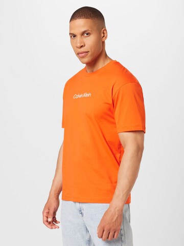 oranžs Calvin Klein T-Krekls 'Hero': no priekšpuses