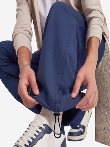Tommy Life Široke hlačnice Športne hlače 'Jogginghose' | modra barva