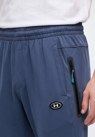 UNDER ARMOUR - Tapered Pantalón deportivo 'Utility' en gris