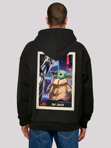 Sweat-shirt 'Star Wars The Mandalorian The Child Card' F4NT4STIC en noir : devant
