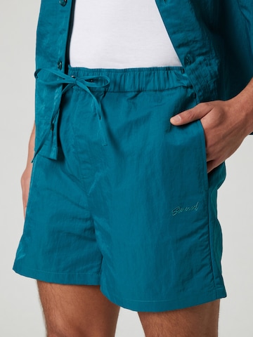 Sinned x ABOUT YOU Regular Trousers 'Keno' in Green
