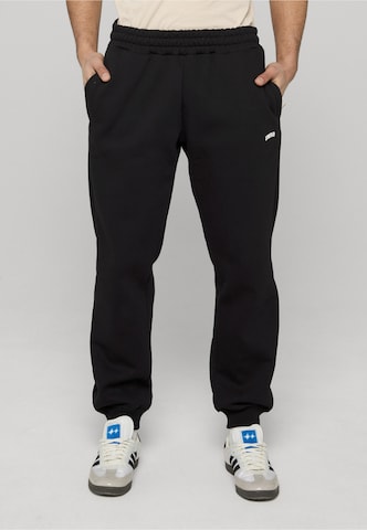 Unfair Athletics Tapered Outdoorbroek 'TTW' in Zwart: voorkant