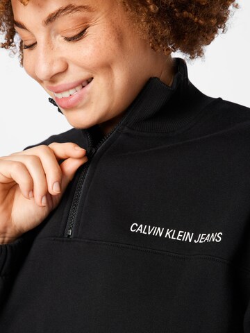 juoda Calvin Klein Jeans Curve Megztinis be užsegimo
