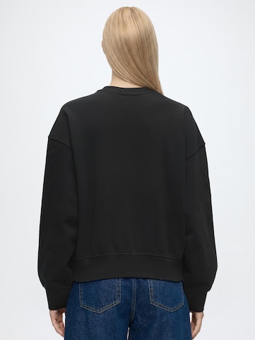 Calvin KleinSweater majica - crna boja