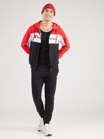 Tuta da jogging di Champion Authentic Athletic Apparel in rosso