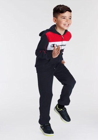 Champion Authentic Athletic Apparel Tracksuit in Blue