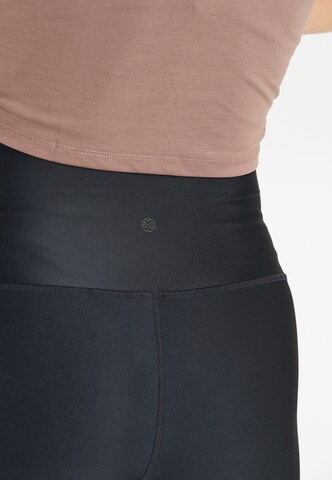 Athlecia Skinny Sports trousers in Black