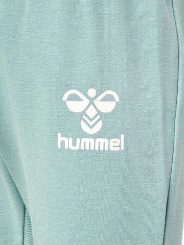 Effilé Pantalon de sport Hummel en vert